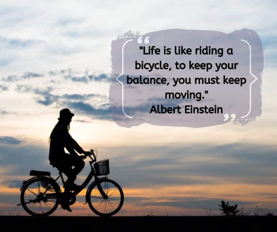A lady riding on a bicycle with a quote from Albert Einstein "Life is like riding a bicycle, to keep your balance, you must keep moving."